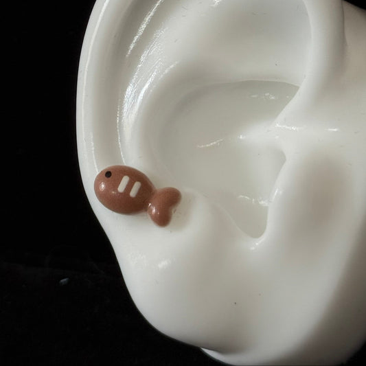 Kawaii fish titanium piercing stud with toasted brown gradient — part of Meowverse cat jewelry collection by Kawaii Piercing Club